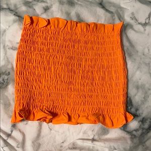 Bright orange tube top